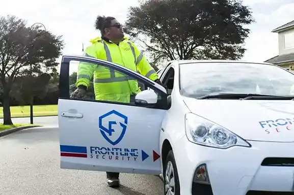 Frontline Security staff enter Frontline Security Vehicle